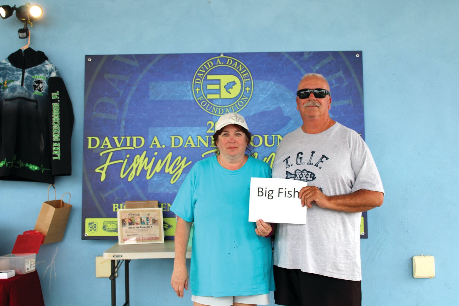 Dan and Mary Burr with 7.58 pound big fish award and fourth place overall with 14.70 pounds total weight.